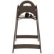 A brown Koala Kare high chair with a black seat strap.