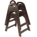 A brown plastic Koala Kare high chair with a strap.