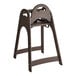 A brown unassembled designer high chair with a simple, sturdy frame and safety straps.