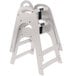 A gray Koala Kare high chair with black straps.