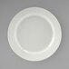 A Tuxton Pacifica bright white china plate with a curved edge.