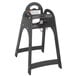 A black Koala Kare baby high chair with a tray and a handle.