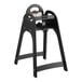 A black Koala Kare child's high chair with a handle and seat.