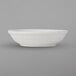 A white Tuxton China fruit bowl with an embossed design.