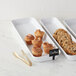 a group of cookies in a white container