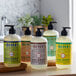 A group of Mrs. Meyer's Lemon Verbena hand soap bottles with black pumps.