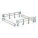 A white metal frame with several hooks for a shelf.