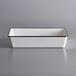 A white rectangular melamine serving bowl with black trim.