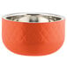 An orange Bon Chef bowl with a diamond pattern and silver rim.