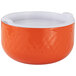 An orange bowl with a white interior and exterior.