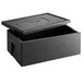 A black Vollrath top loading food pan carrier on a table.