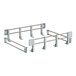 A white rack with metal shelves and metal hooks.