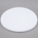 A white round Scrubble by ACS 41-20 floor pad on a gray surface.