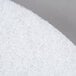 A close-up of a white Scrubble by ACS Type 41 20" polishing floor pad.