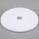 A white Scrubble 20" circular floor pad with a hole in the middle.