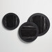 A black and white round serving platter with white lines.