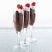 A group of Libbey Embassy Flute Glasses filled with chocolate desserts.