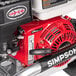 A Simpson aluminum gas-powered pressure washer with a red handle.