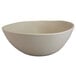 A white Elite Global Solutions melamine bowl with a curved edge.