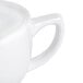 A close-up of a CAC white porcelain cappuccino cup.