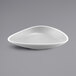 a white bowl on a gray background