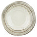 A white melamine bowl with brown speckled designs.