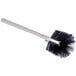 A Carlisle Sparta coffee decanter brush with a white handle and black and white bristles.