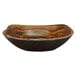 A wood grain rectangular melamine serving bowl with a curved edge.