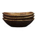 A stack of three Elite Global Solutions rectangular melamine serving bowls with brown wood grain on top.