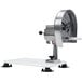 A silver circular metal Nemco Easy Slicer on a white surface.