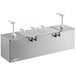 A Nemco stainless steel condiment bar with pumps and condiment pans on a counter.