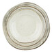 An Elite Global Solutions Doheny melamine bowl with a beach design featuring a white bowl with brown specks.