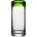 A clear shot glass with a green rim.