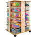 A Whitney Brothers wooden storage tower with plastic trays.