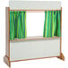 A Whitney Brothers wooden puppet theater with striped curtains on a wooden stand.