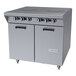 A stainless steel commercial gas range with two hot top sections, six control knobs, and a double-door storage base.