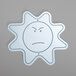 A white drawing of a sun with a sad face.