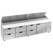 A large stainless steel counter with six drawers.