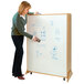 A woman using the Whitney Brothers 9-Cubby Mobile Storage and Teaching Center to write on a whiteboard.