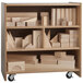 A Whitney Brothers wooden storage cart with blocks on shelves.