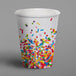 A Creative Converting paper hot cup with sprinkles on it.