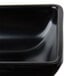 A close up of a black square Carlisle ramekin.
