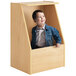 A young boy sitting in a Whitney Brothers wooden toy box.