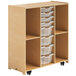 A Whitney Brothers wooden mobile storage cabinet with white plastic bins.