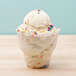 a scoop of ice cream with sprinkles