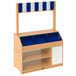 A wooden display stand with blue trays and a blue and white striped awning.