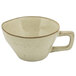 A beige porcelain cup with a handle.