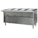 An Eagle Group stainless steel hot food table with sliding doors on a counter in a large commercial kitchen.