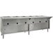 A stainless steel Eagle Group Spec Master hot food table with sliding doors on a counter in a large kitchen.