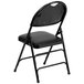 a black folding chair with a black seat